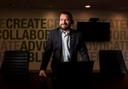 Kevin Sharpen, I.T. Manager at Application Development, speaks on his headset in the boardroom in Toronto, on Wednesday, December 19, 2018. Sharpen's company has fully transitioned away from traditional phones to a cost saving digital version. THE CANADIAN PRESS/Nathan Denette
