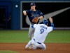 Tampa Bay Rays second baseman Joey Wendle (18) turns the double play getting Toronto Blue Jays catcher Danny Jansen (9) out at second and Blue Jays' Brandon Drury at first during seventh inning MLB American League baseball action in Toronto on Friday July 26, 2019. THE CANADIAN PRESS/Nathan Denette