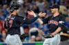 Cleveland Indians starting pitcher Shane Bieber celebrates with teammate Kevin Plawecki (27) after pitching a complete game shutout against the Toronto Blue Jays MLB American League baseball action in Toronto on Wednesday July 24, 2019. THE CANADIAN PRESS/Nathan Denette