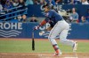 Minnesota Twins shortstop Jorge Polanco (11) hits a single during seventh inning MLB baseball action against the Toronto Blue Jays in Toronto on Wednesday May 8, 2019. THE CANADIAN PRESS/Nathan Denette
