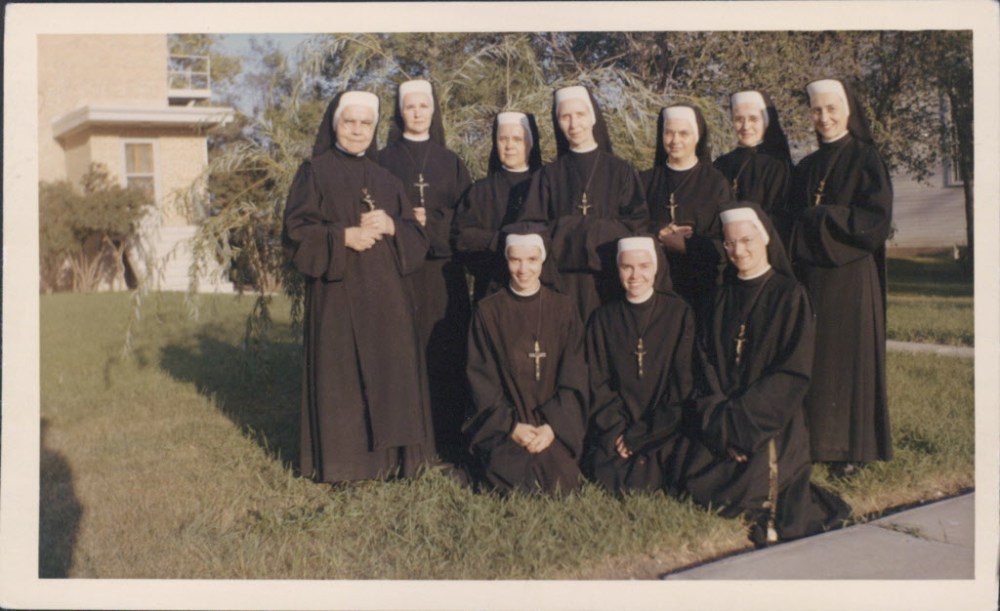 Winnipeg Free Press
The nuns of the Sisters of the Cross in 1950, with their real names in brackets. Front row: Sister Jeanne Lucille (Berthe Alarie), Sister Dominique (Dolores Poirier) and Sister Gertrude-Thérèse (Rachel Schaubroeck). Back row: Sister Agnes-Eulalie (Germaine Mith), Sister Andre Saint-Louis (Clementine Bedard), Sister Helene Saint-Joseph (Rose-Helene Paulhus), Sister Esther (Madeleine Brunet), Sister Iréne Thérèse (Reva Dubois), Sister Blandine-Marie (Ghislaine de Moissac) and Sister Roseline des Arcs (Madeleine de Moissac).