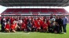 Members of the Canadian women's national soccer team pose alongside newly sworn-in Canadians after a special citizenship ceremony at BMO Field in Toronto on Friday, May 17, 2019. THE CANADIAN PRESS/Neil Davidson