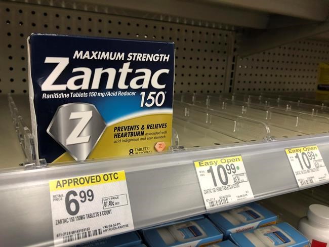 FILE - This Sept. 30, 2019, file photo shows a box of Maximum Strength Zantac tablets at a pharmacy in Miami Beach, Fla. Drugmaker Sanofi is recalling its over-the-counter heartburn drug Zantac in the U.S. and Canada because of possible contamination. The French company Friday, Oct. 18, 2019 joined other drugmakers that have recently recalled their versions of the popular heartburn and ulcer drug. (AP Photo/Wilfredo Lee, File)