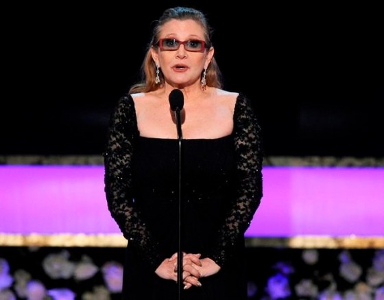 FILE - In this Sunday, Jan. 25, 2015 file photo, Carrie Fisher presents the life achievement award on stage at the 21st annual Screen Actors Guild Awards at the Shrine Auditorium in Los Angeles. Fisher has reportedly been transported to a hospital after suffering a severe medical emergency on a flight Friday, Dec. 23, 2016. (Photo by Vince Bucci/Invision/AP, File)