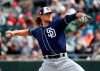 FILE - In this March 8, 2019, file photo, San Diego Padres pitcher Chris Paddack throws against the Oakland Athletics during the first inning of a spring training baseball game, in Mesa, Ariz. The 23-year-old Paddack, a promising right-hander, will be part of San Diego‚Äôs rotation when the regular season begins. (AP Photo/Matt York, File)