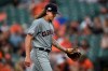 FILE - In this June 28, 2019, file photo, Cleveland Indians pitcher Mike Clevinger walks to the dugout after giving up four runs to the Baltimore Orioles in the first inning of a baseball game, in Baltimore. The Indians made one stirring comeback after another through a season littered with adversity, misfortune and unexpected challenges. Their last one fell short. For the first time since 2015, baseball’s postseason will go on without them. (AP Photo/Gail Burton, File)