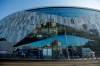 FILE - This is a Feb. 15, 2019, file photo showing Tottenham Hotspur stadium in London. Years before Tottenham Hotspur Stadium started rising like a spaceship in a north London neighborhood needing regeneration, planning on how to finance it was under way nearly 3,500 miles away. (AP Photo/Matt Dunham, File)