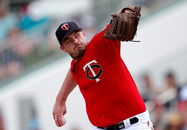 FILE - In this Monday, March 11, 2019 file photo, Minnesota Twins pitcher Addison Reed (43) works against the Detroit Tigers in the fourth inning of a spring training baseball game in Fort Myers, Fla. Relief pitcher Addison Reed has been designated for assignment by the Minnesota Twins following a rocky start to his rehabilitation assignment for a sprained thumb on his non-throwing hand that set him back in spring training. The move was made on Thursday, May 16, 2019 before the Twins played at Seattle, making room on the 40-man roster for right-handed reliever Austin Adams. (AP Photo/John Bazemore, File)