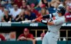 FILE - In this June 28, 2018, file photo, Oregon State's Adley Rutschman hits an RBI single to score Cadyn Grenier during the third inning of Game 3 against Arkansas in the NCAA College World Series baseball finals, in Omaha, Neb. The Baltimore Orioles lead off the Major League Baseball Draft for the first time in 30 years and Oregon State catcher Adley Rutschman is a heavy favorite to be selected No. 1 on Monday night, June 3, 2019. (AP Photo/Nati Harnik, File)