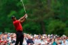 FILE - In this April 14, 2019, file photo, Tiger Woods hits on the 12th hole during the final round for the Masters golf tournament, in Augusta, Ga. Woods hit 9-iron to the fat of the green after watching two other players hit into the water. (AP Photo/David J. Phillip, File)