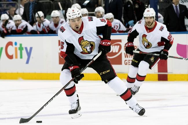 FILE - In this April 3, 2019, file photo, Ottawa Senators defenseman Cody Ceci (5) controls the puck during the first period of an NHL hockey game against the New York Rangers, at Madison Square Garden in New York. The Toronto Maple Leafs acquired defenseman Cody Ceci, a 2020 third-round pick and minor leaguers Ben Harpur and Aaron Luchuk from the Ottawa Senators for defenseman Nikita Zaitsev, forward Connor Brown and minor leaguer Michael Carcone. The teams announced the trade early on Monday, July 1, 2019, roughly three and a half hours before the start of free agency. (AP Photo/Mary Altaffer, File)