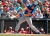 FILE - In this March 7, 2019, file photo, New York Mets' Tim Tebow bats in the first inning of the team's spring training baseball game against the Washington Nationals in West Palm Beach, Fla. Mets minor leaguer Tebow is expected to miss the rest of the season due to a cut on his left hand. The 31-year-old Tebow hit .163 in 77 games during his first season with Triple-A Syracuse but hasn’t played since July 21 after injuring himself fielding a ball in the outfield. The laceration required several stitches. Syracuse’s regular season ends Sept. 2. (AP Photo/Brynn Anderson, File)