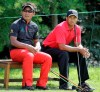 FILE - In this June 6, 2010, file photo, Tiger Woods, right, and Thongchai Jaidee, of Thailand, sit on a bench in the 17th tee box during the fourth round of the Memorial golf tournament at Muirfield Village Golf Club in Dublin, Ohio. Woods has had a profound effect on golf in his mother's native Thailand. (AP Photo/Amy Sancetta, File)