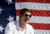 FILE - This Sept. 10, 2012 file photo shows Michael Phelps smiling during a celebration of the achievements of Maryland Olympians, in Baltimore. The most decorated Olympian will join David Feherty for a special, Ryder Cup-themed edition of 