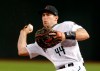 FILE - In this Friday, Sept. 21, 2018 file photo, Arizona Diamondbacks first baseman Paul Goldschmidt (44) throws during a baseball game against the Arizona Diamondback in Phoenix. John Mozeliak has built enough championship clubs in St. Louis that he immediately recognized after the Cardinals failed to make the playoffs last season that changes needed to be made. So with an aggressive approach to the offseason, Mozeliak traded for six-time All-Star first baseman Paul Goldschmidt to provide some pop to his lineup, then he signed two-time All-Star reliever Andrew Miller to a $25 million, two-year contract to close out games at the back of the bullpen. (AP Photo/Rick Scuteri, File)