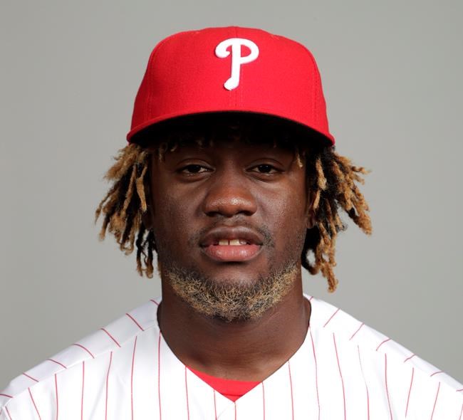 FILE - This is a 2018 file photo showing Odubel Herrera of the Philadelphia Phillies baseball team. Philadelphia Phillies outfielder Odubel Herrera has been placed on administrative leave by Major League Baseball following his arrest in a domestic violence case at an Atlantic City casino. The commissioner's office put Herrera on leave Tuesday, May 28, 2019, a day after his arrest on an assault charge at the Golden Nugget casino. (AP Photo/Lynne Sladky, File)