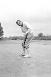 FILE - In this June 9, 1960, file photo, Max Faulkner putts at Wentworth Club in Virginia Water, England. The British Open returns to Royal Portrush on July 18-21, 2019, for the first time since 1951, the only other time golf's oldest championship as been held outside Scotland or England. Max Faulkner won his only major on a rainy final day in Northern Ireland. (AP Photo/File)