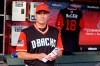 FILE - In this Sunday, Aug. 26, 2018 file photo, Arizona Diamondbacks manager Torey Lovullo stands in front of a Sen. John McCain jersey in the dugout before a baseball game against the Seattle Mariners in Phoenix. The Arizona Diamondbacks have given manager Torey Lovullo a two-year contract extension through the 2021 season. (AP Photo/Rick Scuteri, File)