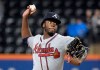FILE - In this Sept. 25, 2018, file photo, Atlanta Braves pitcher Touki Toussaint delivers the ball to a New York Mets batter during the first inning of a baseball game, in New York. There is room for at least one young pitcher to emerge in Atlanta's rotation as the Braves pitchers and catchers prepare to report to spring training this week. Touki Toussaint and Mike Soroka are two names to watch. (AP Photo/Bill Kostroun, File)