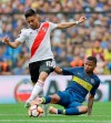 FILE - In this Nov. 11, 2018, file photo, Gonzalo Martinez of Argentina's River Plate (10) and Wilmar Barrios of Argentina's Boca Juniors battle for the ball during a Copa Libertadores first leg final match in Buenos Aires, Argentina. Martinez has been acquired by Atlanta United, bolstering a team that won the MLS Cup championship in just its second season. United announced the long-anticipated transfer on Thursday, Jan. 24, 2019. (AP Photo/Natacha Pisarenko, File)