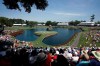 FILE - In this May 9, 2014, file photo, golfers play the 17th hole during the second round of The Players Championship golf tournament at TPC Sawgrass in Ponte Vedra Beach, Fla. In a first for golf, The Players Championship will make available live streaming coverage of every shot from every player.(AP Photo/John Raoux, FIle)