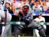 FILE - In this June 2, 2018, file photo, Los Angeles Dodgers catcher Yasmani Grandal fields the throw from left fielder Matt Kemp to put out Colorado Rockies' Charlie Blackmon during the first inning of a baseball game in Denver. The Milwaukee Brewers upgraded their catching situation when they finalized an $18.25 million, one-year contract with Grandal in January. Manny Pina, veteran journeyman Erik Kratz and prospect Jacob Nottingham also are in the mix behind the plate. (AP Photo/David Zalubowski, File)