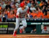 FILE - In this Sept. 21, 2018, file photo, Los Angeles Angels' Shohei Ohtani lines out against the Houston Astros during the fourth inning of a baseball game in Houston. Ohtani has been medically cleared to resume full strength training on his right arm following Tommy John surgery, although he will not be ready to hit for the Angels by opening day. Angels general manager Billy Eppler provided a positive update Thursday, Jan. 31, on the recovery of his two-way star. (AP Photo/David J. Phillip, File)