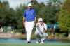 FILE - In this Dec. 12, 2015, file photo, Davis Love III, left, talks with his son Dru, right, on the 18th hole during the first round of the Father Son Challenge golf tournament in Orlando, Fla. The son has been playing on sponsor exemptions. The father wishes he would instead build a regular schedule on a smaller tour. (AP Photo/Willie J. Allen Jr., File)