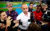 FILE - In this June 10, 2019, file photo, Miami Marlins CEO Derek Jeter, center, talks with members of the media before the start of a baseball game between the Marlins and the St. Louis Cardinals, in Miami. Derek Jeter watched the first pitch on opening day from the owner’s box next to the dugout, but within a few innings retreated to a more secluded location and rarely returned to his field-level seat during the season. Alas, from whatever vantage point, Jeter’s team looked bad. (AP Photo/Wilfredo Lee, File)