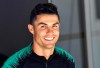 FILE - In this June 8, 2019, file photo, Portugal's Cristiano Ronaldo smiles when he arrives to a training session at the Bessa stadium in Porto, Portugal. Soccer star Cristiano Ronaldo won’t face criminal charges after a woman accused him of raping her at a Las Vegas Strip resort in 2009. Prosecutor Steve Wolfson said in a statement Monday, July 22, 2019, that after reviewing a new police investigation, he determined that sexual assault claims can’t be proven beyond a reasonable doubt and no charge will be filed. (AP Photo/Martin Meissner, File)