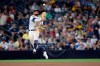 FILE - In this Aug. 8, 2019, file photo, San Diego Padres shortstop Fernando Tatis Jr. throws to first base late on a single by Colorado Rockies' Yonathan Daza during the sixth inning of a baseball game, in San Diego. Padres rookie shortstop Fernando Tatis Jr. has become one of major league baseball’s most exciting young players, showing an instinct and aggressiveness that make it hard to believe he’s only 20. (AP Photo/Orlando Ramirez, File)