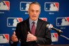 FILE - In this Feb. 1, 2018, file photo, Major League Baseball commissioner Rob Manfred speaks during a news conference in Los Angeles. Major League Baseball and its players' union reached an unprecedented agreement to discuss renegotiating their labor contract that has three seasons remaining, part of a deal that includes modest rule changes for 2020 and drops pitch clocks until 2022 at the earliest. (AP Photo/Mark J. Terrill, File)