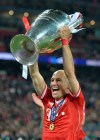FILE - In this May 25, 2013, file photo, Bayern Munich's Arjen Robben of the Netherlands lifts the trophy after winning the Champions League Final soccer match against Borussia Dortmund at Wembley Stadium in London. Former Bayern Munich and Netherlands forward Arjen Robben has announced his retirement from soccer. The 35-year-old Robben, who was thought to be looking for a new club after playing his last game for Bayern in May, says in a statement, Thursday, July 4, 2019, 