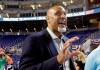 FILE - In this July 9, 2017, file photo, Tony Clark, head of the MLB Players Association, stands on the field before the All-Star Futures baseball game in Miami. Players' union head Tony Clark criticized baseball Commissioner Rob Manfred for blaming players‚Äô demands for the slow free agent market and said an increasing number of teams make little effort to 