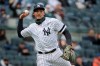 FILE - In this March 31, 2019, file photo, New York Yankees' Miguel Andujar throws to first base during the second inning of the team's baseball game against the Baltimore Orioles at Yankee Stadium in New York. Andújar is set to come off the injured list Saturday, and the team hopes infielder DJ LeMahieu will return to the lineup that day as well. Yankees outfielder Clint Frazier is scheduled to follow on Monday, when center fielder Aaron Hicks could begin a minor league rehab assignment. With 13 players still on the injured list, manager Aaron Boone gave a long rundown of medical status reports Friday, May 3, before New York opened a homestand against the major league-leading Minnesota Twins. (AP Photo/Seth Wenig, File)