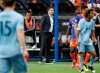 FILE - In this April 7, 2019, file photo, FC Cincinnati coach Alan Koch, center, watches during the second half of the team's MLS soccer match against Sporting Kansas City, in Cincinnati. FC Cincinnati fired coach Alan Koch on Tuesday, May 7, 2019, after the Major League Soccer expansion team‚Äôs 11th first-tier match. (AP Photo/John Minchillo, File)