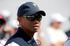 FILE - In this Sept. 28, 2017, file photo, Tiger Woods looks on before the first round of the Presidents Cup golf tournament at Liberty National Golf Club in Jersey City, N.J. The last time Tiger Woods was at Liberty National, he hadn't played in eight months and couldn't guarantee he would play again. So much has changed in two years as the FedEx Cup playoffs begin. (AP Photo/Julio Cortez, File)