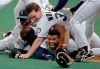 FILE - In this Oct. 8, 1995, file photo, Seattle Mariners' Ken Griffey Jr. smiles from beneath a pile of teammates who mobbed him after he scored the winning run in the bottom of the 11th inning of a baseball game against the New York Yankees, in Seattle. The Seattle Mariners are the only baseball franchise never to advance to the Fall Classic. Baseball has never been played in Seattle beyond Oct. 22. The Mariners have three times been to the American League Championship Series, and all three times were sent home before there could ever be a Game 7.(AP Photo/Elaine Thompson, File)