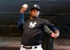 FILE - In this Feb. 14, 2019, file photo, New York Yankees starting pitcher Luis Severino throws in the bullpen at the Yankees spring training baseball facility, in Tampa, Fla. Severino has been scratched from his first scheduled spring training start due to right shoulder discomfort. Severino was slated to face the Atlanta Braves on Tuesday, March 5, 2019, but was replaced by Stephan Tarpley.(AP Photo/Lynne Sladky, File)