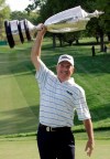 FILE - In this May 25, 2008, file photo, Jay Haas holds up the trophy and celebrates winning the Senior PGA Championship golf tournament at Oak Hill Country Club in Rochester, N.Y. It didn't take long for Haas to be reminded of how gusting winds can play havoc on those making their way around Oak Hill Country Club's East Course. 