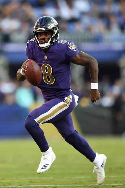 FILE - In this Nov. 25, 2018, file photo, Baltimore Ravens quarterback Lamar Jackson looks for a receiver in the second half of an NFL football game against the Oakland Raiders, in Baltimore. Since taking over as the starting quarterback, rookie Lamar Jackson has revitalized the Ravens running attack and kept opposing offenses off the field by dominating time of possession. He will need do that again this week to help slow down the high-flying Kansas City Chiefs, who lead the NFL with 37 points per game.(AP Photo/Gail Burton, File)