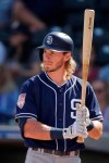 FILE - In this Feb. 28, 2019, file photo, San Diego Padres' Travis Jankowski bats during the second inning of a spring training baseball game against the Kansas City Royals, in Surprise, Ariz. Padres outfielder Travis Jankowski will miss the first couple months of the season after breaking a bone in his right wrist while diving to catch a fly ball against Texas. Padres manager Andy Green said Tuesday, March 5, 2019, an MRI revealed the fracture and Jankowski will have surgery this week.(AP Photo/Charlie Riedel, File)