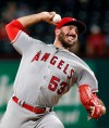FILE - In this Sept. 3, 2018, file photo, then-Los Angeles Angels pitcher Blake Parker (53) delivers against the Texas Rangers during the ninth inning of a baseball game, in Arlington, Texas. The Minnesota Twins have a handful of candidates to be their closer this season, the biggest question to be answered during spring training. The leading contenders are newcomer Blake Parker, returners Trevor May, Trevor Hildenberger, Taylor Rogers and Addison Reed along with young converted starter Fernando Romero. (AP Photo/Mike Stone, File)