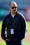 FILE - In this Feb. 16, 2013, file photo, New York Yankees general manager Brian Cashman watches a workout at baseball spring training in Tampa, Fla. Cashman has broken his right leg and dislocated the ankle while parachute jumping from a plane in Florida. Cashman jumped with the U.S. Army Golden Knights in a plane from Homestead Air Reserve Base outside Miami, a fundraiser for the Wounded Warrior Project. He was hurt on his second jump Monday, March 4, 2013. (AP Photo/Matt Slocum, File)
