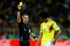 FILE - In this July 3, 2018, file photo, referee Mark Geiger shows a yellow card to Colombia's Juan Cuadrado during the round of 16 match between Colombia and England at the 2018 soccer World Cup in Moscow, Russia.Â Geiger, the first American to referee in the knockout stage of the World Cup, is retiring after 15 seasons in Major League Soccer. The Professional Referee Organization, which oversees on-field officials in the United States and Canada, plans to announce Wednesday, Jan. 9, 2019, the 44-year-old will become its director of senior match officials. (AP Photo/Victor R. Caivano, File)