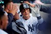 FILE - In this Saturday, March 30, 2019 photo, New York Yankees' Troy Tulowitzki is congratulated by teammates after hitting a solo home run against the Baltimore Orioles during the ninth inning of a baseball game in New York. The Orioles won 5-3. (AP Photo/Julie Jacobson, File)