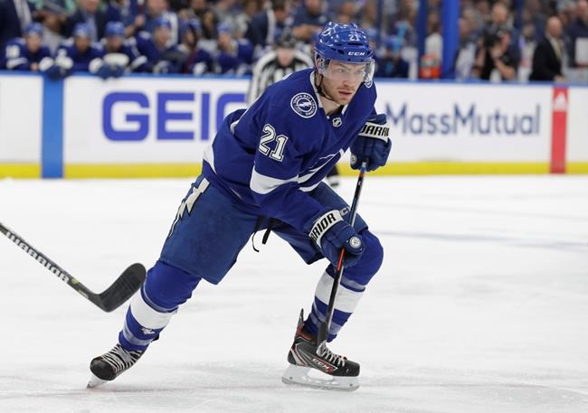 FILE - In this April 12, 2019, file photo, Tampa Bay Lightning center Brayden Point (21) is shown during the second period of Game 2 of an NHL Eastern Conference first-round hockey playoff series against the Columbus Blue Jackets, in Tampa, Fla. A person with knowledge of the situation says the Tampa Bay Lightning have signed restricted free agent forward Brayden Point to a $20.25 million, three-year contract. The person spoke to The Associated Press on condition of anonymity because the deal hadn’t been announced. (AP Photo/Chris O'Meara, File)