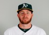 FILE - This is a Tuesday, Feb. 19, 2019, file photo showing Robbie Grossman of the Oakland Athletics baseball team. The Athletics will take a look at Grossman as a potential leadoff man when they open spring play.(AP Photo//Matt York, File)