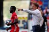FILE - In this May 19, 2019, file photo, Atlanta United head coach Frank de Boer, right, yells instructions to his team during the first half of an MLS soccer match against the New York Red Bulls, in Harrison, N.J. Atlanta United, the defending MLS Cup champions, are heading into the playoffs from essentially the same position as last season. (AP Photo/Steve Luciano, File)