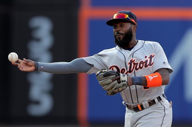 FILE - In this May 25, 2019, file photo, Detroit Tigers second baseman Josh Harrison turns a double play against the New York Mets during the eighth inning of an interleague baseball game in New York. The Detroit Tigers have released second baseman Josh Harrison after reinstating him from the injured list. The team announced the move Friday, Aug. 9, 2019. (AP Photo/Julio Cortez, File)